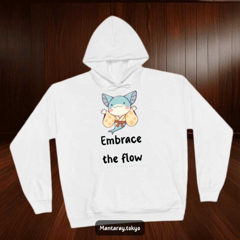 Funny whimsical manta ray in a kimono with flowing sleeves, waving, depicted on a warm and humorous hoodie.